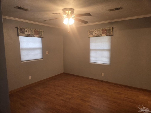 spare room with ceiling fan, wood-type flooring, a textured ceiling, and ornamental molding