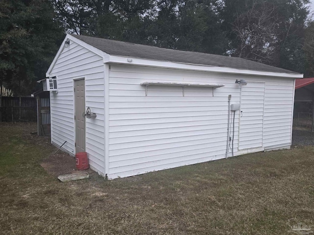 view of outdoor structure with a lawn