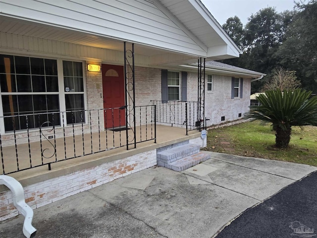 doorway to property with a porch