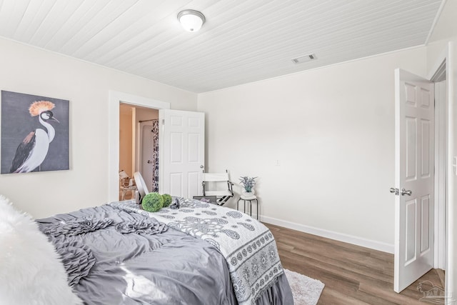 bedroom featuring dark hardwood / wood-style floors