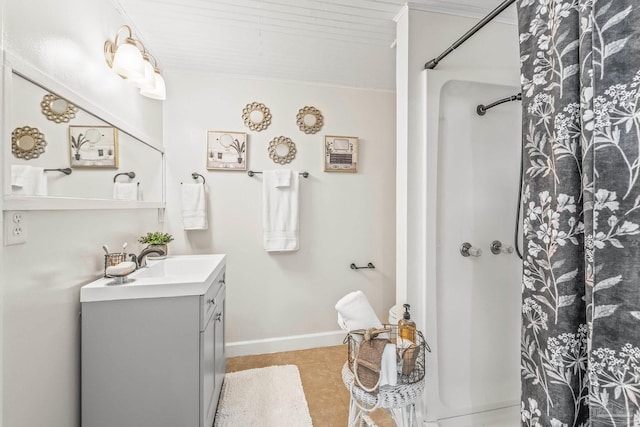 bathroom featuring tile patterned flooring, vanity, and a shower with shower curtain