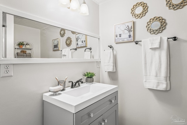 bathroom featuring vanity and crown molding