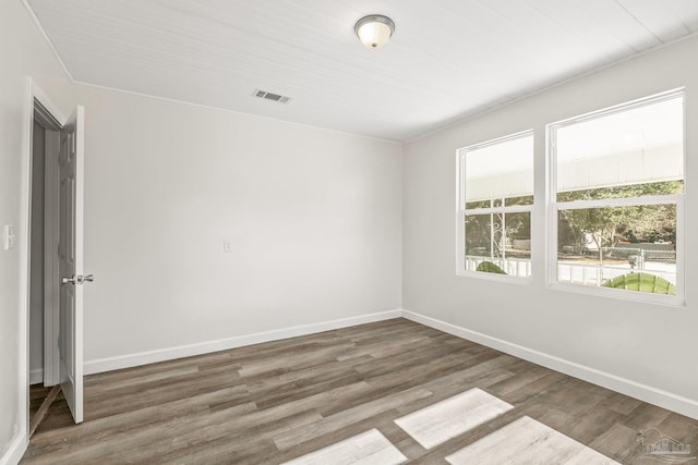 empty room featuring dark wood-type flooring