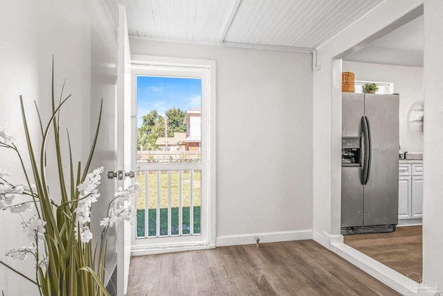 doorway featuring hardwood / wood-style floors and plenty of natural light