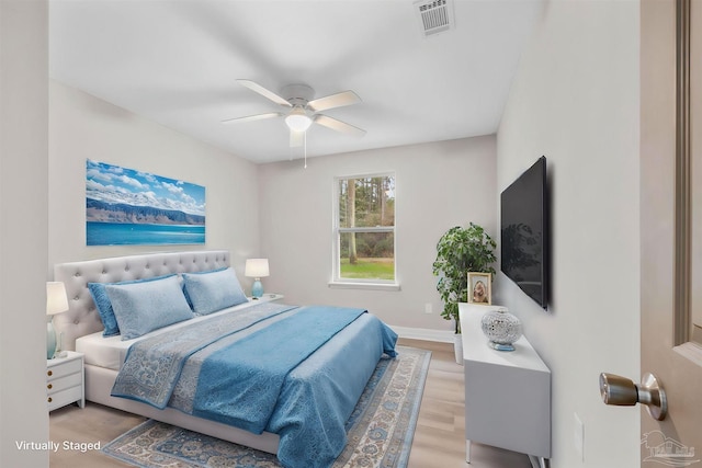 bedroom with ceiling fan and light wood-type flooring