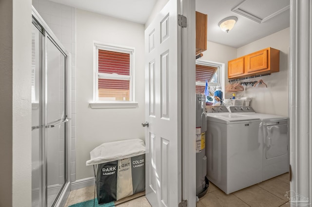 clothes washing area with light tile patterned floors, laundry area, and washing machine and dryer