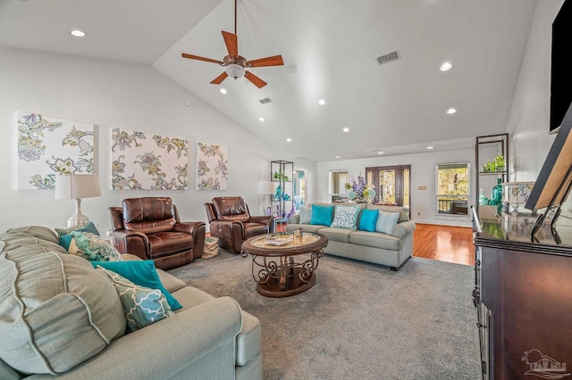 living room featuring recessed lighting, visible vents, high vaulted ceiling, and wood finished floors