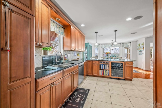 kitchen with light tile patterned floors, a peninsula, a sink, wine cooler, and dishwasher