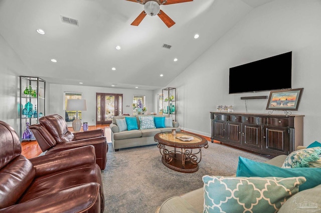 living room featuring visible vents, recessed lighting, high vaulted ceiling, and wood finished floors