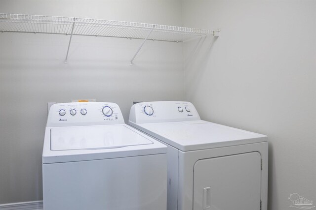 laundry area with washing machine and dryer