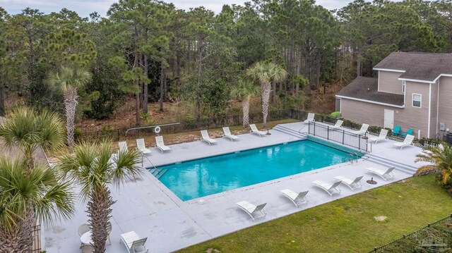 view of swimming pool with a lawn and a patio