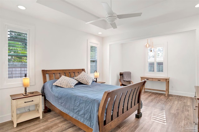 bedroom featuring light hardwood / wood-style floors and ceiling fan