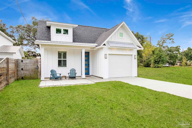 modern farmhouse with a garage and a front yard