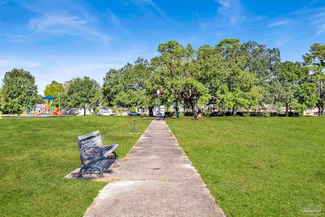 surrounding community featuring a yard and a playground