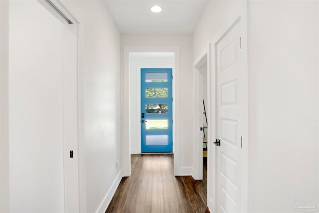 hall with dark hardwood / wood-style flooring