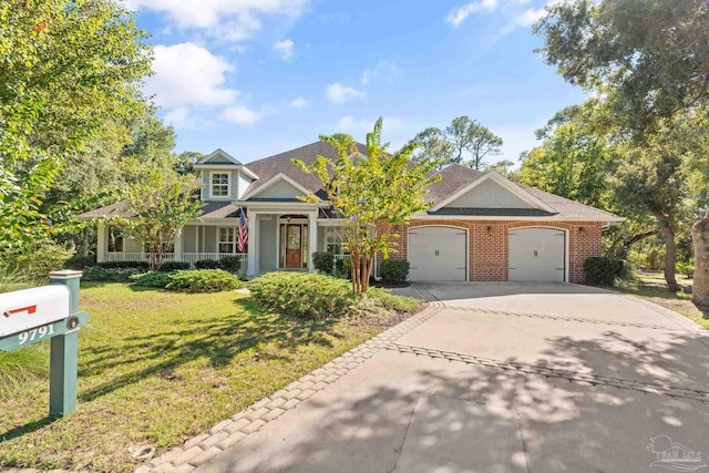 view of front facade with a front yard and a garage