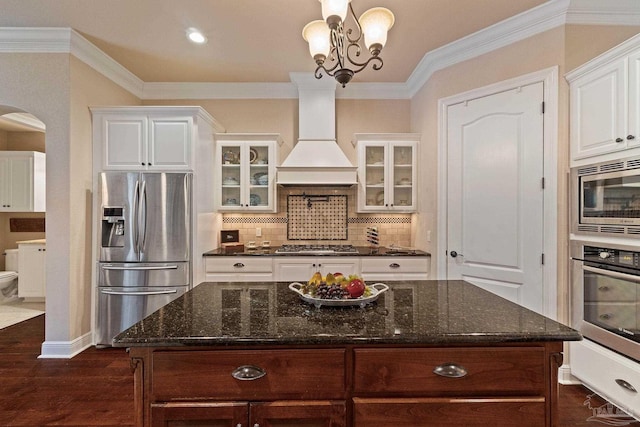 kitchen featuring white cabinetry, stainless steel appliances, dark hardwood / wood-style flooring, and custom exhaust hood