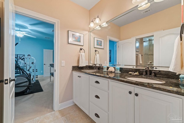 bathroom featuring vanity, a shower, tile patterned floors, and ceiling fan