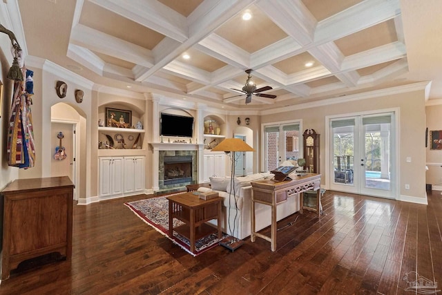 living room featuring dark hardwood / wood-style flooring, ornamental molding, beamed ceiling, french doors, and coffered ceiling