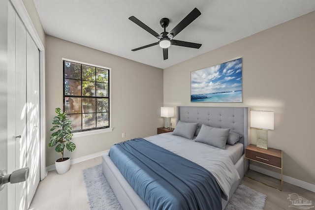 bedroom featuring a closet, hardwood / wood-style flooring, and ceiling fan