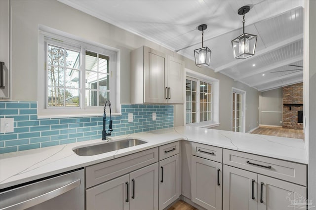 kitchen featuring vaulted ceiling with beams, sink, hanging light fixtures, gray cabinets, and stainless steel dishwasher