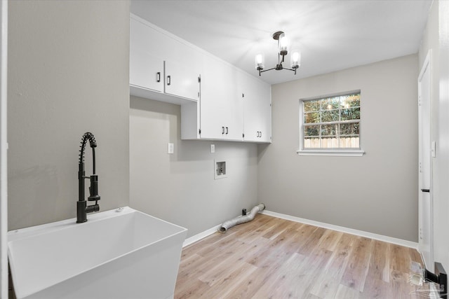 laundry room with an inviting chandelier, light hardwood / wood-style floors, hookup for a washing machine, cabinets, and sink