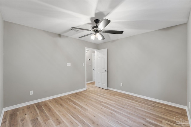 spare room with light hardwood / wood-style floors and ceiling fan