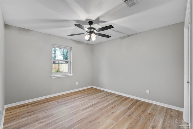 empty room featuring ceiling fan and light hardwood / wood-style floors