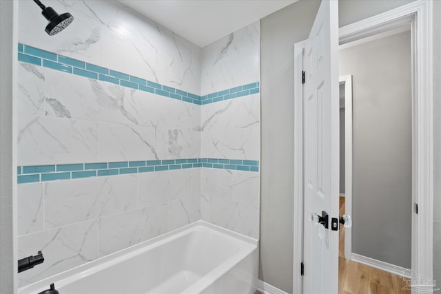 bathroom featuring tub / shower combination and hardwood / wood-style floors