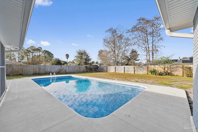 view of swimming pool with a lawn and a patio