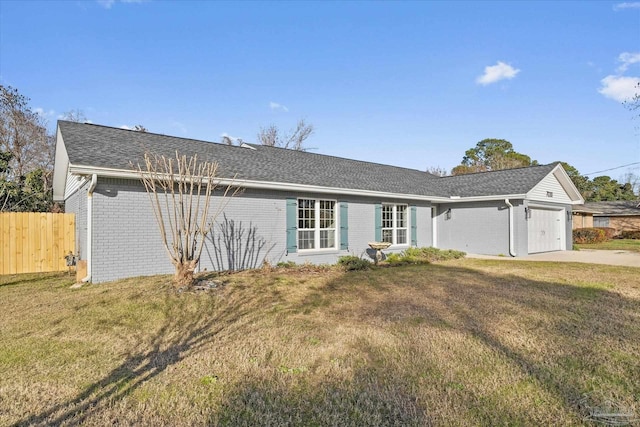 single story home with a garage and a front lawn