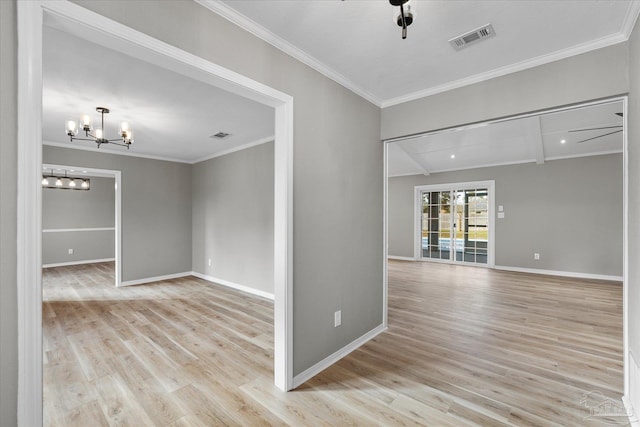 unfurnished room featuring crown molding, light wood-type flooring, and ceiling fan with notable chandelier