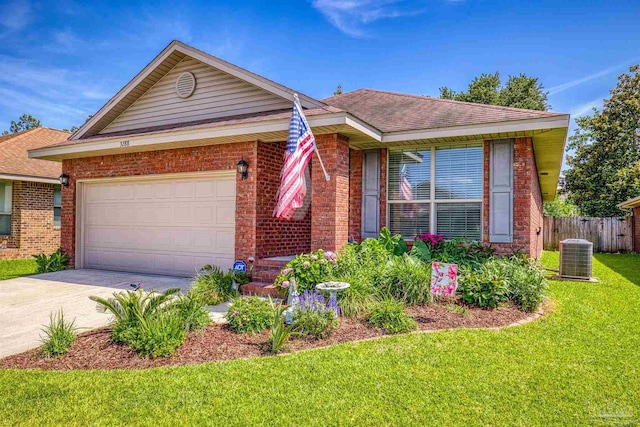 3288 Wasatch Range Loop, Pensacola, FL 32526 - view of front of house with brick siding, concrete driveway, cooling unit, and an attached garage