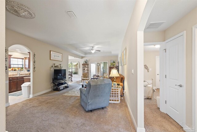 3288 Wasatch Range Loop, Pensacola, FL 32526 - living area featuring light colored carpet, arched walkways, and plenty of natural light