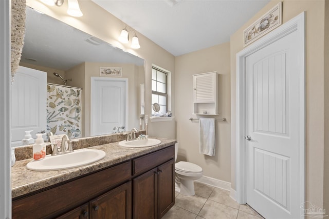 3288 Wasatch Range Loop, Pensacola, FL 32526 - full bathroom featuring tile patterned floors, toilet, double vanity, curtained shower, and baseboards