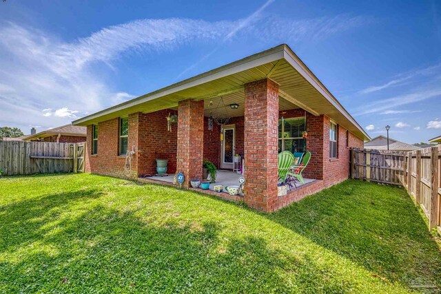 3288 Wasatch Range Loop, Pensacola, FL 32526 - rear view of house with brick siding and a patio