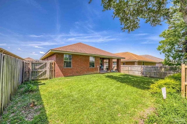 3288 Wasatch Range Loop, Pensacola, FL 32526 - rear view of property featuring brick siding and a shingled roof