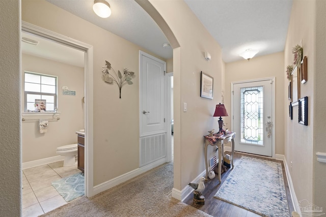 3288 Wasatch Range Loop, Pensacola, FL 32526 - foyer with arched walkways and baseboards