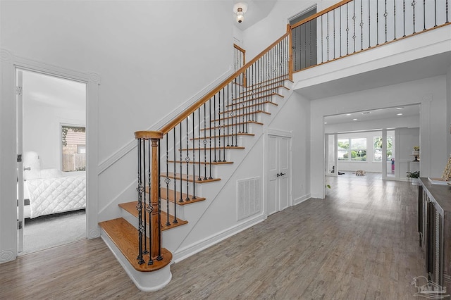 stairs featuring hardwood / wood-style flooring