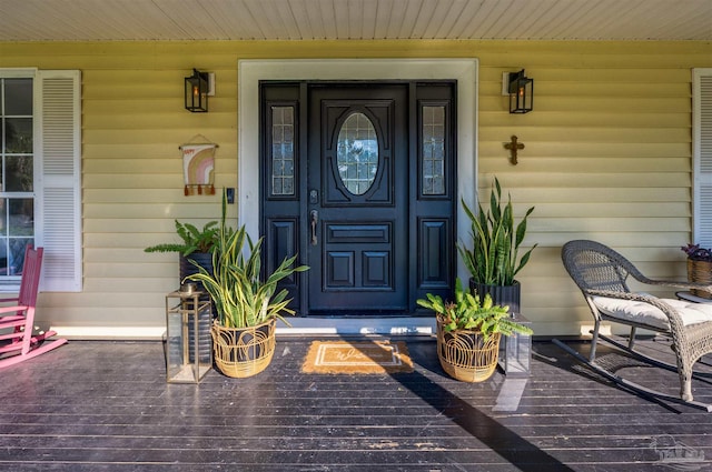 doorway to property with a porch