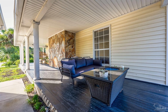 deck featuring outdoor lounge area