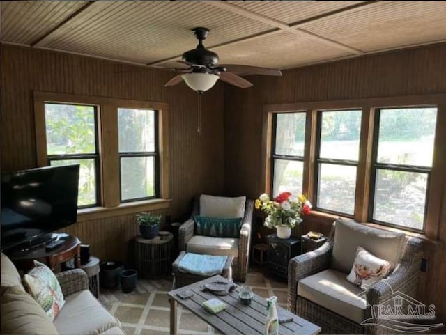 5301 Gentle Breeze Dr, Tallahassee, FL 32317 - living room featuring wooden walls and a ceiling fan