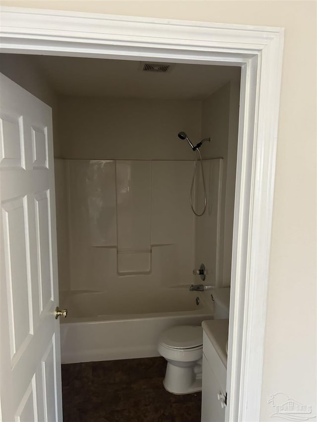 full bathroom with vanity, toilet, and washtub / shower combination