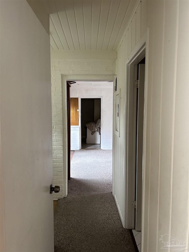 corridor featuring light colored carpet