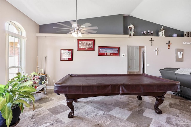 rec room featuring stone finish flooring, a ceiling fan, pool table, and vaulted ceiling