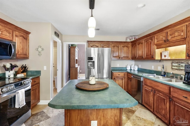 kitchen with brown cabinetry, stainless steel appliances, and a sink