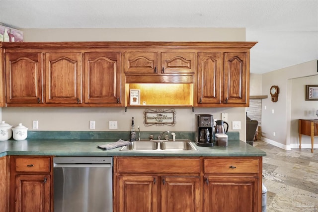 kitchen with dishwasher, baseboards, brown cabinets, and a sink