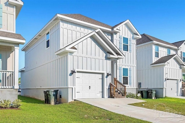 modern farmhouse featuring a garage, concrete driveway, a front lawn, and board and batten siding