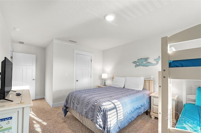 bedroom with light colored carpet, visible vents, and baseboards