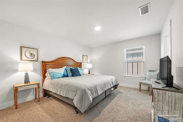 bedroom featuring baseboards, visible vents, and light colored carpet